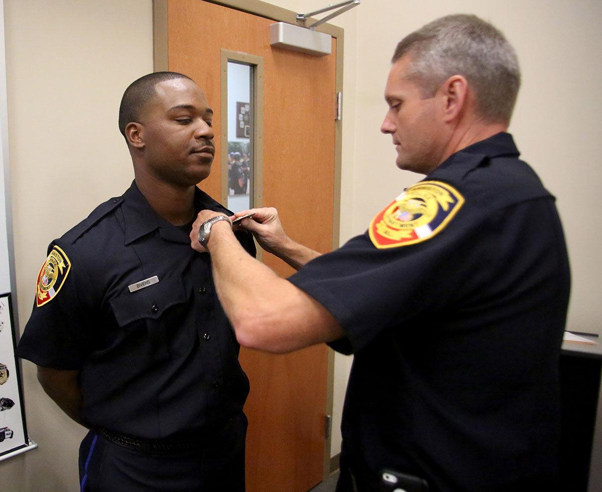 Anniston pins seven new officers with badges