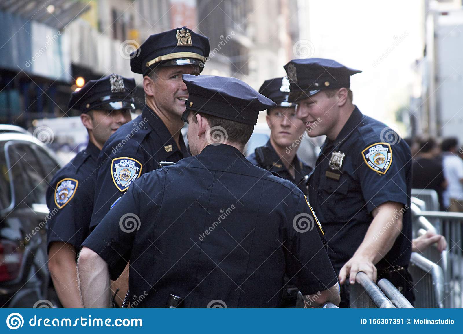 New York Police Officers Talking Outdoors Editorial Photo