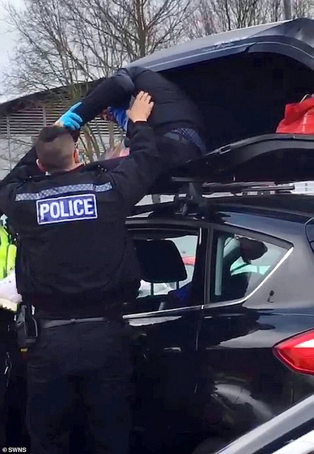 Police break open locked car roof box at M25 service ...