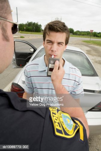 Police Officer Taking Breathalyzer Test Of Man Stock Photo ...