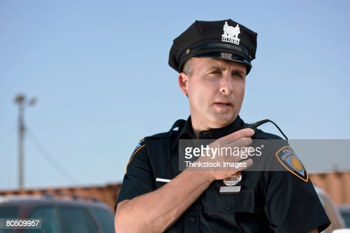 Police Officer Talking Into Walkie Talkie Stock Photo ...