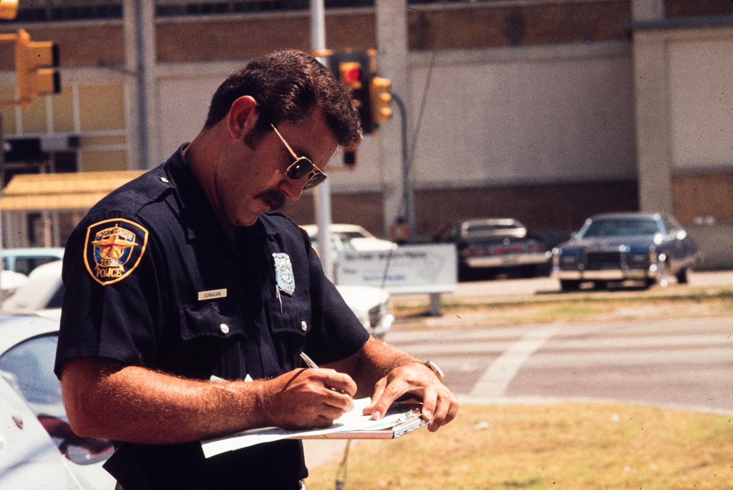 [Police officer writing, 2]